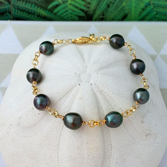 Gold filled bracelet with dark Tahitian pearls on a thick, luxurious yellow gold chain