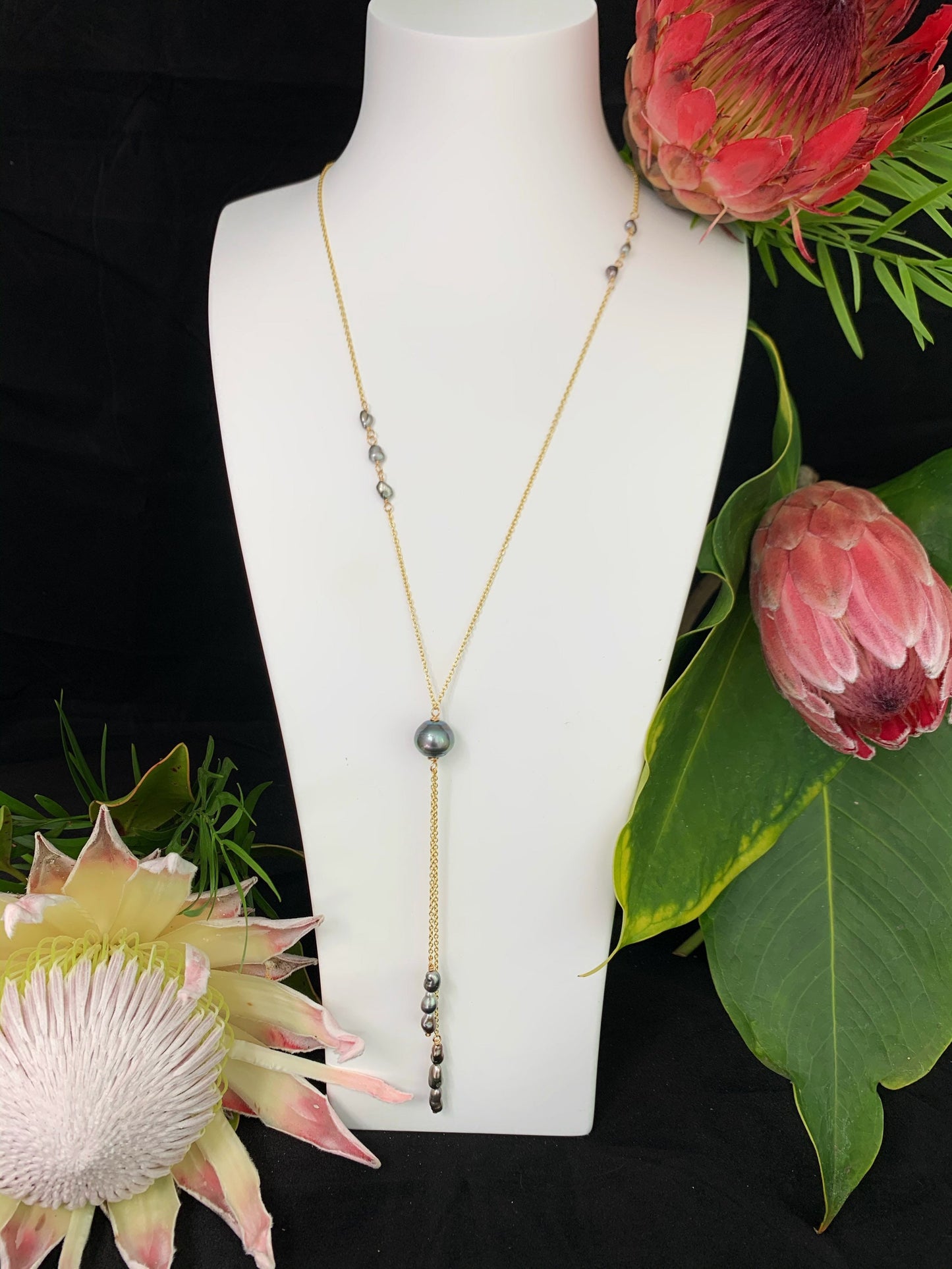 Long tahitian pearl necklace with staggered Keshi on a gold filled chain