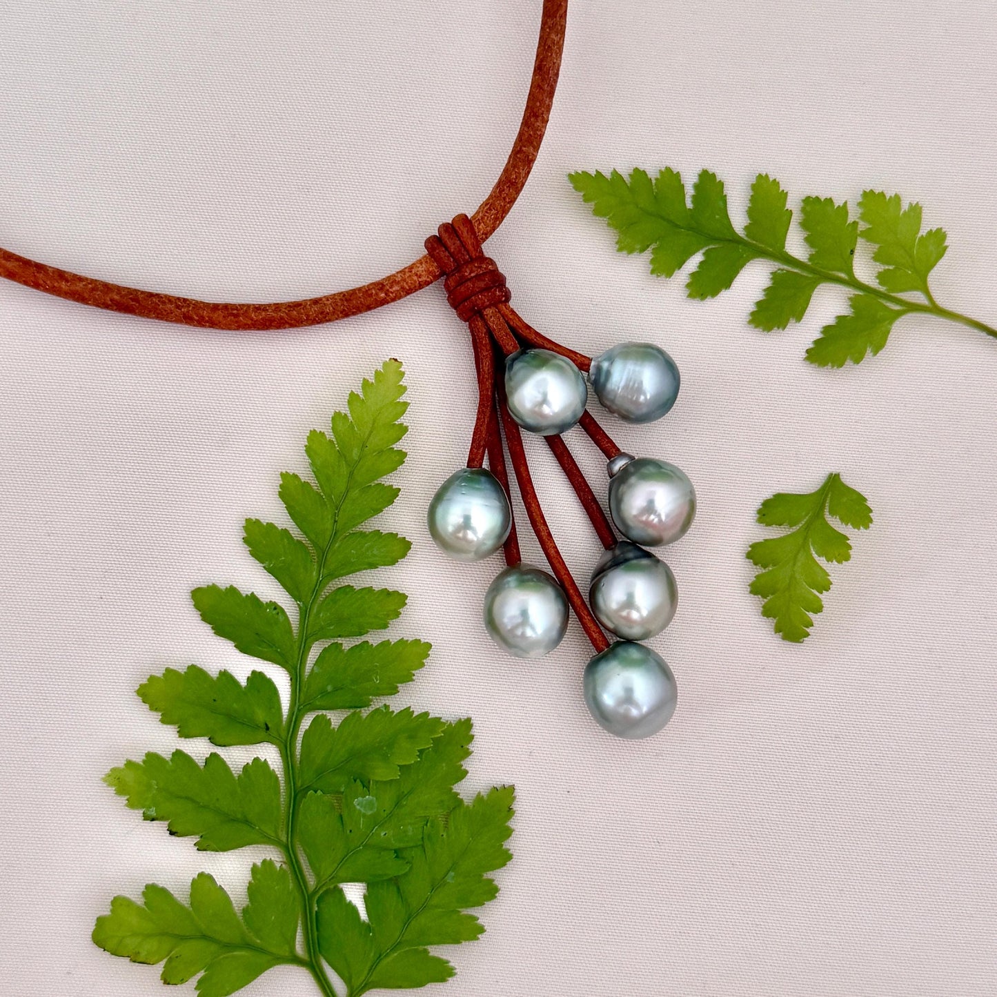 Light pastel Tahitian pearl set on a brown leather cord