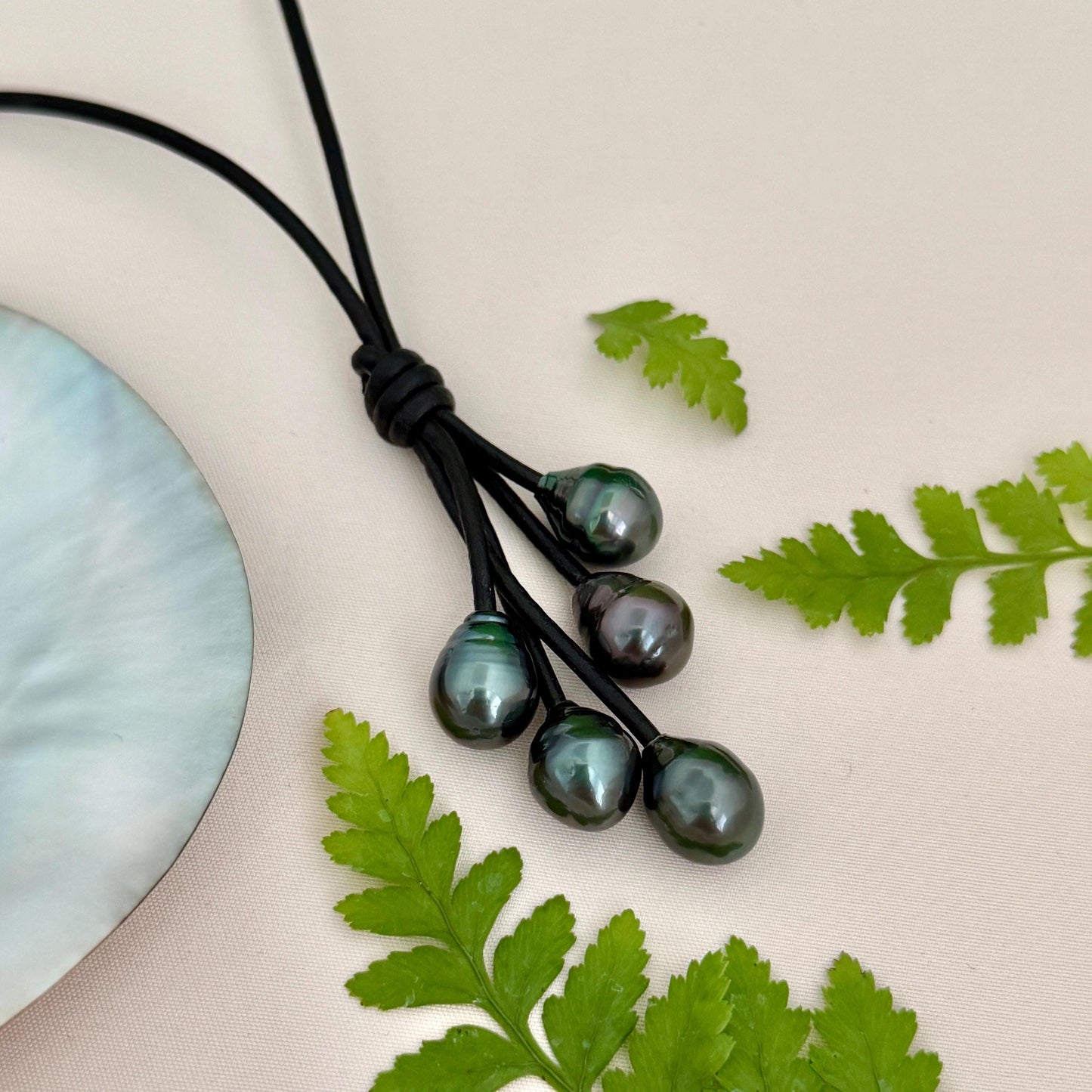 Tahitian pearl cluster necklace with five pearls set on black leather cord