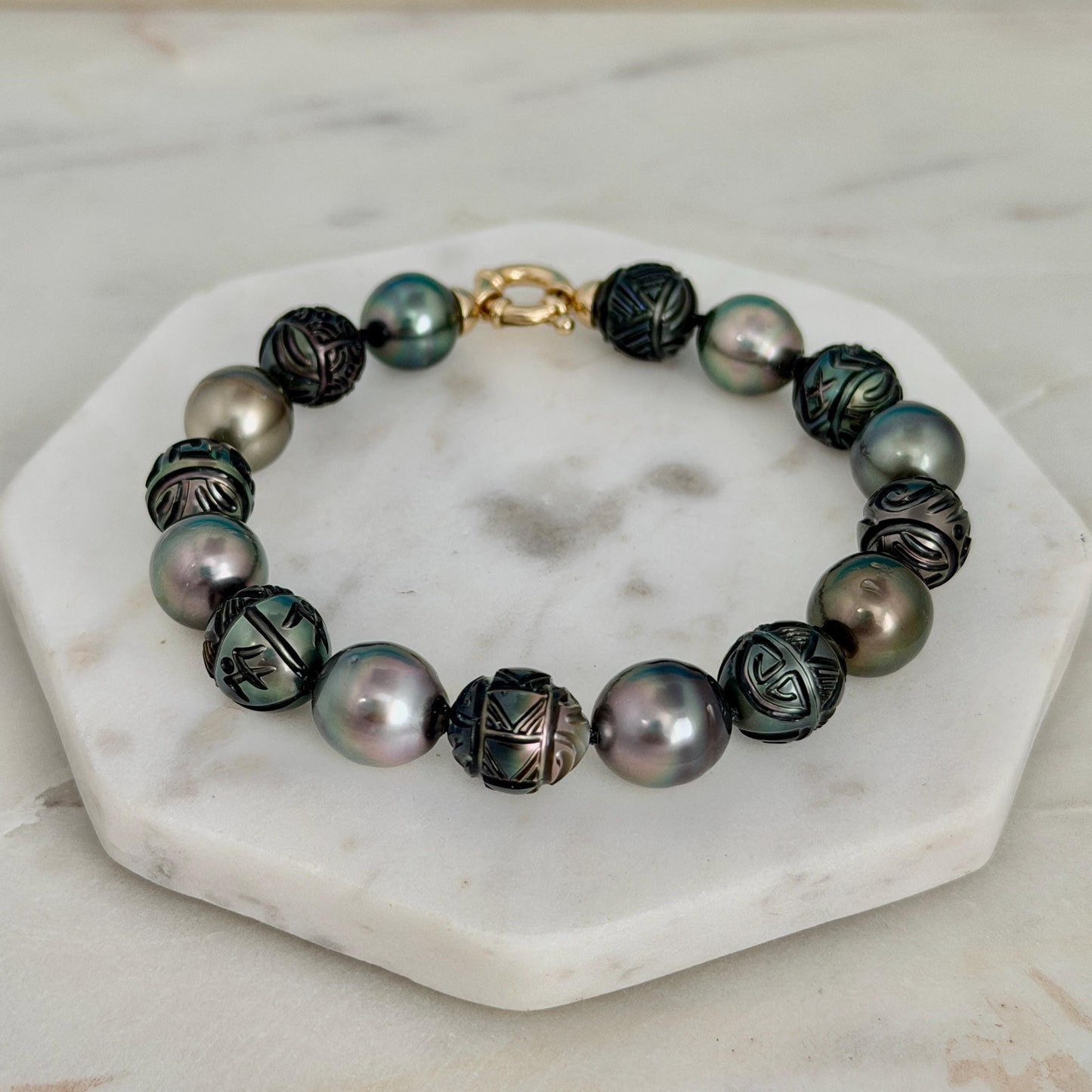 carved pearl strand bracelet